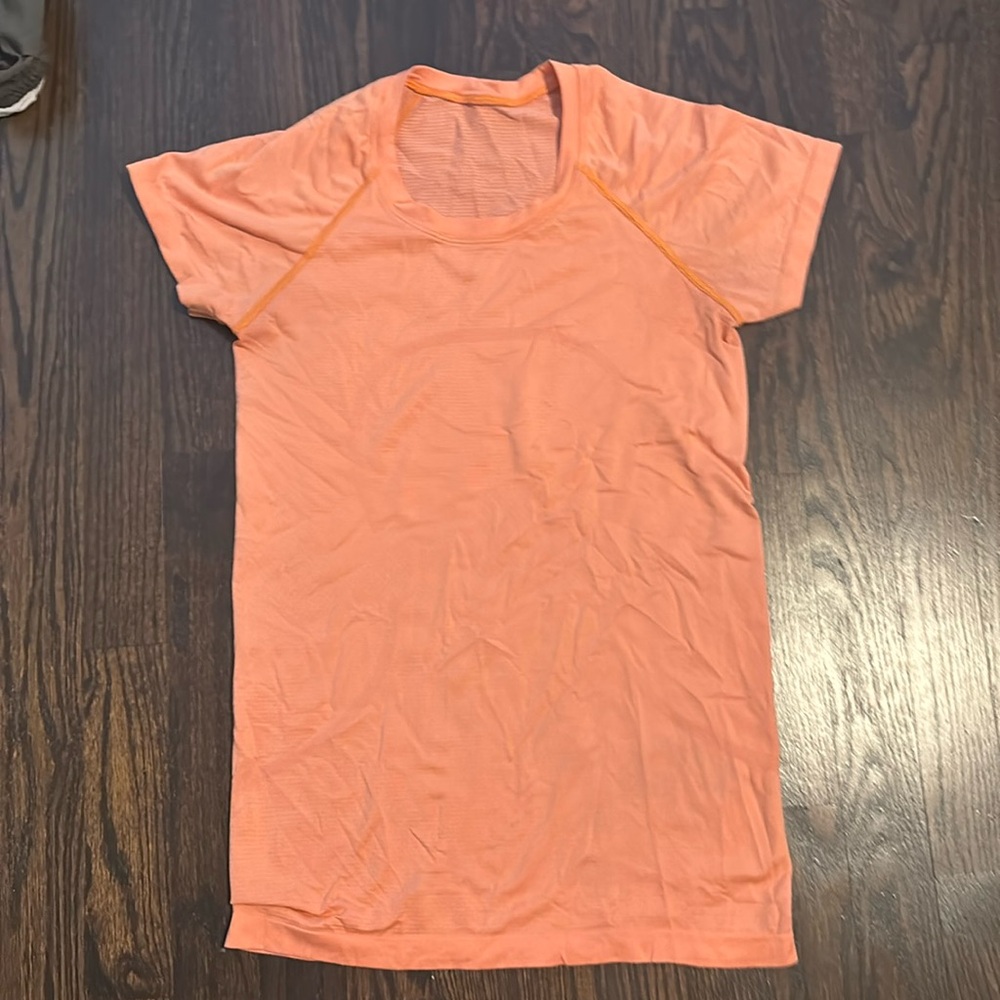 Orange Lululemon Swifty tech T-shirt, size 8
